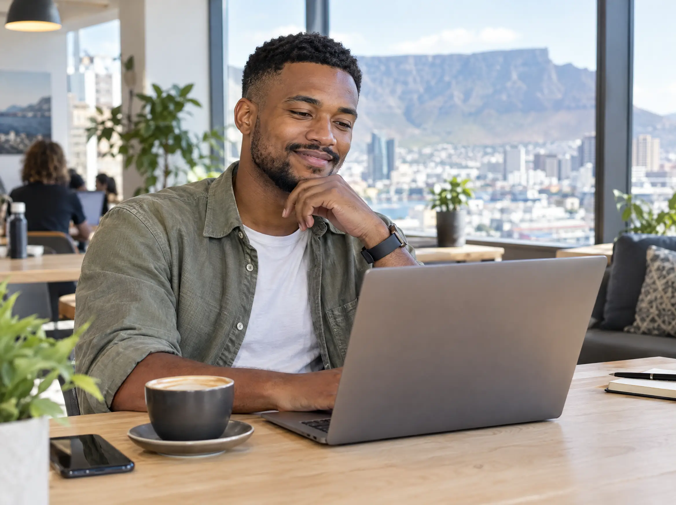 A marketer working on a laptop in a Cape Town co-working space